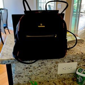 Spartina 449 black nylon mini backpack with colorful print inside and trim.